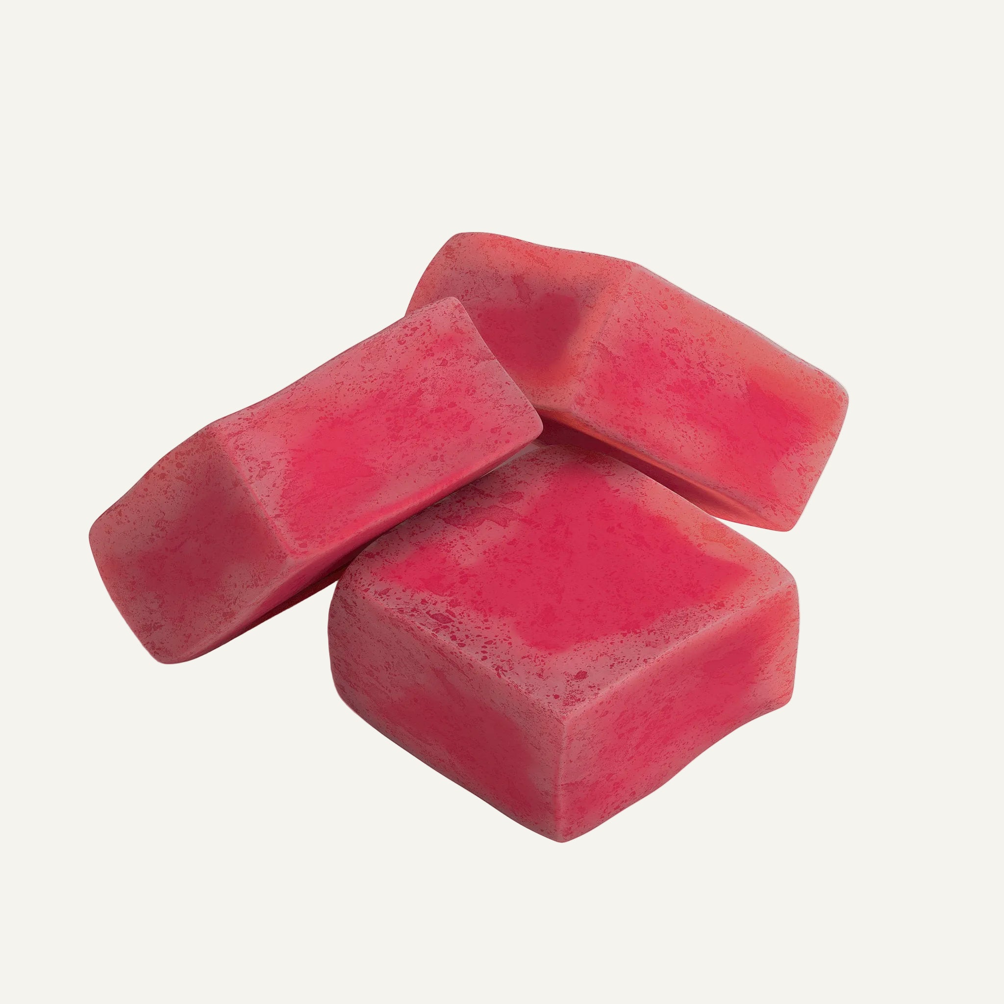 Three pink wax melts on a white background