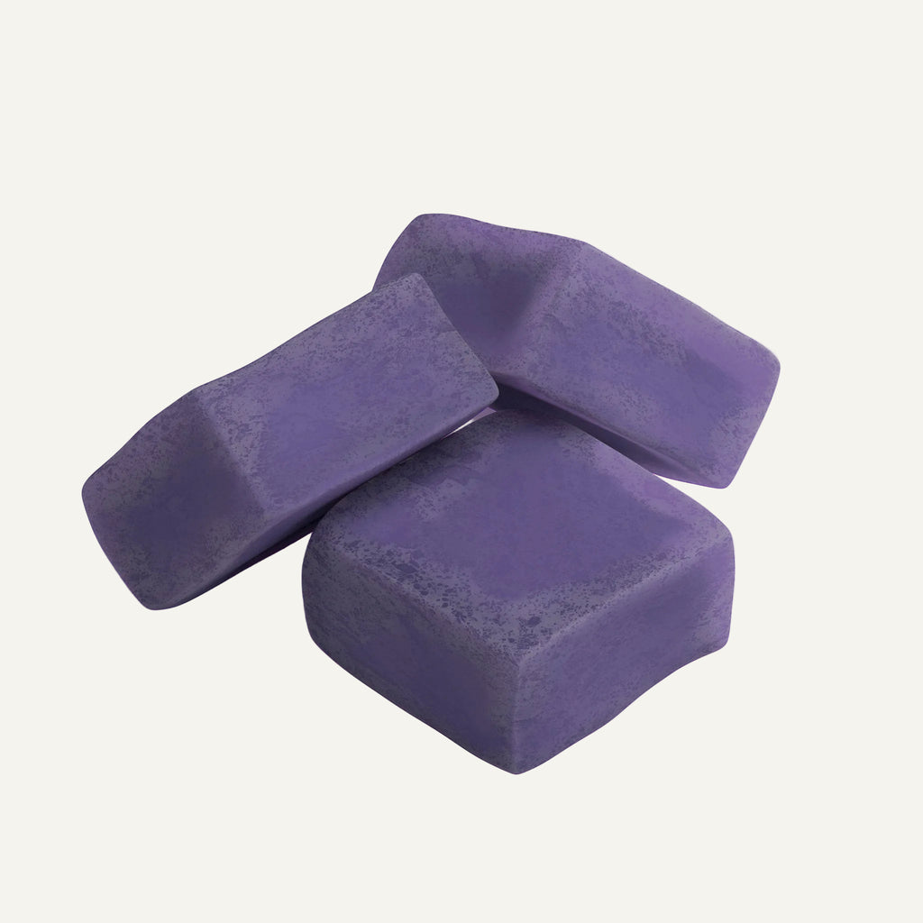 Three purple soap bars on a white background